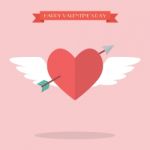 Heart Flying With Cupid Arrow Stock Photo