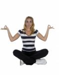 Lady Performing Yoga Sitting In Lotus Pose Stock Photo