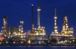 Lighting Of Oil Refinery Plant In Heavy Industry Estate Against Stock Photo