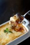 Gratin On Spoon With Smoke Stock Photo