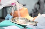 Patient With A Breathing Mask In Operation Room Stock Photo