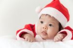 Little Girl With Santa Costume Stock Photo