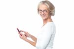 Old Lady Using Tablet Pc Device Stock Photo