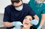 Dentist Examining His Patient Stock Photo