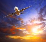 Passenger Jet Plane Preparing To Landing Against Beautiful Dusky Sky Use For Traveling Industry And Cargo Transport Business Topic Stock Photo