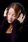 Portrait Of Young Woman Enjoying Music Stock Photo