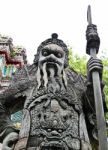 Statue Of Man At Wat Pho In Bangkok, Thailand Stock Photo