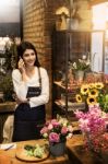 Florist Standing At Her Flower Shop And Using Her Telephone To T Stock Photo