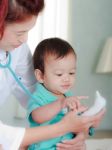 Baby And Medical Instrument Stock Photo