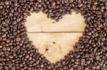 Heart Love Coffee Beans On Wood Stock Photo