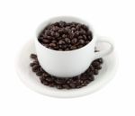 Cup Of Coffee Beans On White Background Stock Photo