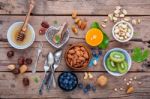 Ingredients For A Healthy Foods Background, Nuts, Honey, Berries Stock Photo