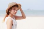 Woman Wear Hat On Beach Stock Photo