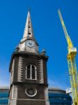 Yellow Crane Next To St Boltolph Without Aldgate Church In Londo Stock Photo