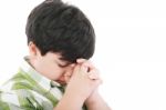 A Boys Praying Stock Photo