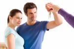 Couple Taking Keys Stock Photo