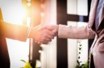 Closeup Friendly Meeting Handshake Between Business Woman And  B Stock Photo