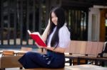 Asia Thai High School Student Uniform Beautiful Girl Read A Book Stock Photo