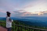 Woman Tourist Watching The Sunrise Stock Photo