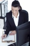 Portrait Of Young Business Woman Working At Her Office Stock Photo