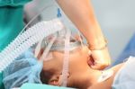 Nurse Preparing The Oxygen Mask To An Undentified Patient For Th Stock Photo