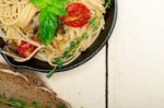 Spaghetti Pasta With Baked Cherry Tomatoes And Basil Stock Photo