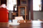 White Coffee Cup On Wooden Table Stock Photo