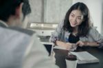 Younger Woman Paper Working On Coffee Table With Boy Friend With Happiness Emotion Stock Photo