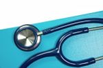 Medical Stethoscope On Blue Folder Stock Photo