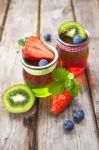 Red And Green Jelly Served With Fruit Stock Photo