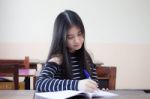 Portrait Of Thai Teen Beautiful Girl Writing Book Stock Photo