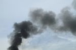 Black Smoke From Fire Burning On The Sky Stock Photo