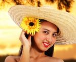 Pretty Girl In A Hat At Sunset Stock Photo