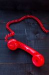 Retro Vintage Red Landline Unhang On Wooden Background Stock Photo