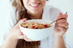 Young Woman In Underwear Eating Cereals. Isolated On White Stock Photo