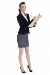 Full Length Of Business Woman Writing In Pad Stock Photo