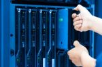 Man Fix Server Network In Data Center Room Stock Photo