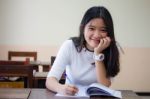 Portrait Of Thai Teen Beautiful Girl Writing Book Stock Photo