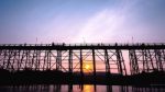 Silhouetted Bridge At Sunset Stock Photo