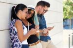 Portrait Of Group Of Friends Having Fun With Smartphones Stock Photo