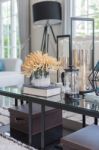 Yellow Flower In Glass Vase And Book  On Glass Table In Living R Stock Photo