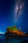 Milky Way Over Tanah Lot Temple At Night In Bali, Indonesia.(dark) Stock Photo