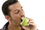 Man Eating Green Apple Stock Photo