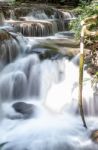 The Water Flowing Over Rocks And Trees Down A Waterfall At Huay Mae Khamin Waterfall National Park ,kanchana Buri In Thailand Stock Photo