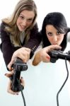 Partners Playing Game And Holding Remote Stock Photo