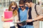 A Group Of Friends Talking In The Street After Class Stock Photo