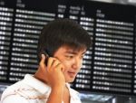 Man Talking On His Mobile Phone In An Airport Stock Photo