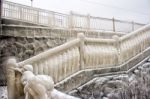 Ice Covered Staircase On The Beach Stock Photo