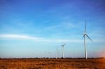 Wind Turbines On Farm Land Stock Photo