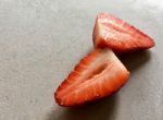 Cut Strawberry On Board Stock Photo